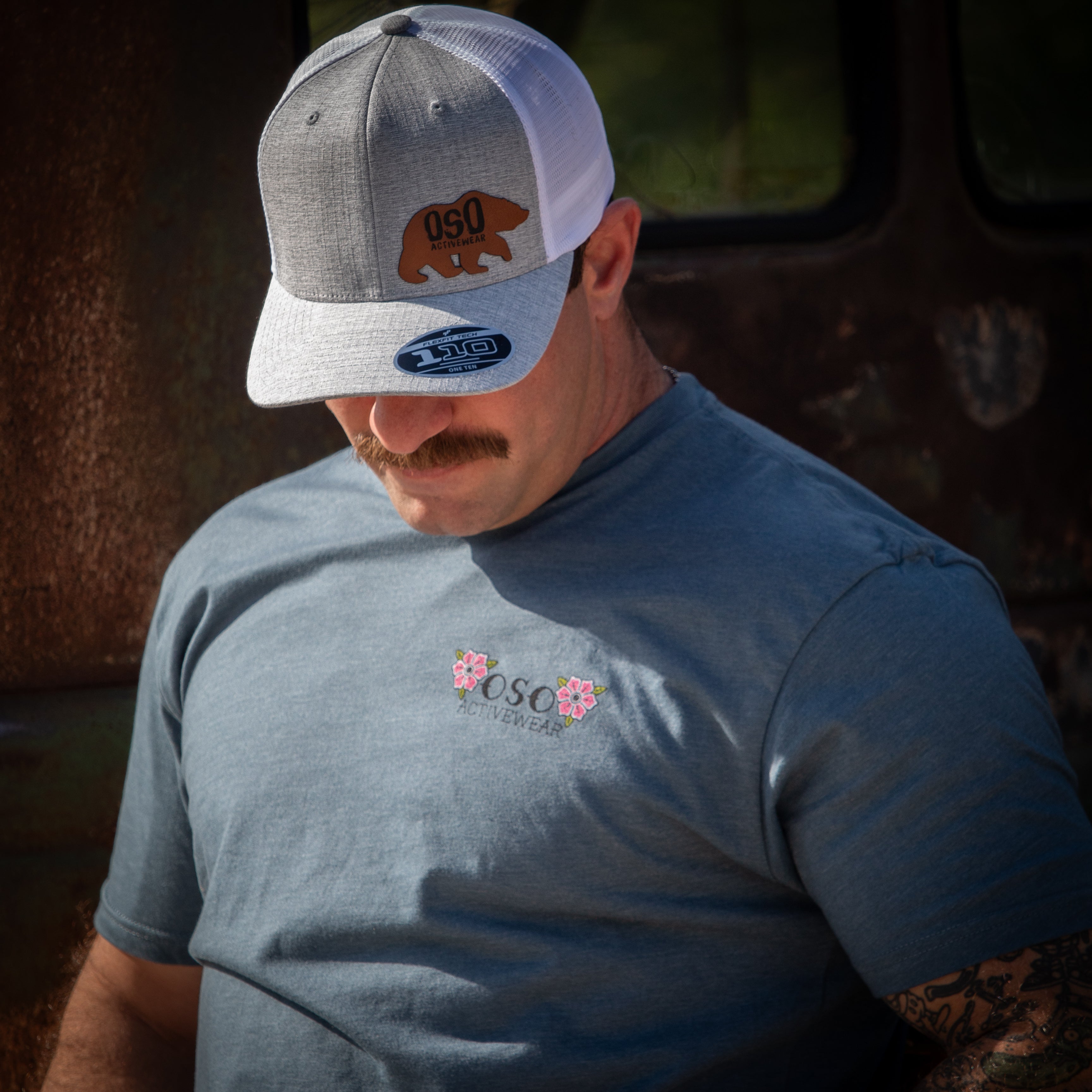 Melange Silver / White Flexfit Trucker Hat - Leatherette Bear Logo Patch
